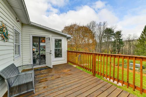 a wooden deck with a bench on a house at 1 Mi to Historic District Mtn-View Franklin Home in Otego