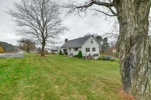 a white house with a tree in the yard at 1 Mi to Historic District Mtn-View Franklin Home in Otego