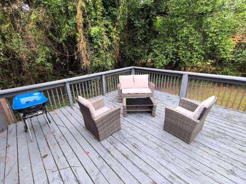 a deck with chairs and a table and a grill at Mins to USC Hospital Zoo Columbia Duet-Unit B in West Columbia