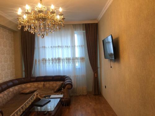 Televisyen dan/atau pusat hiburan di Cozy Apartment