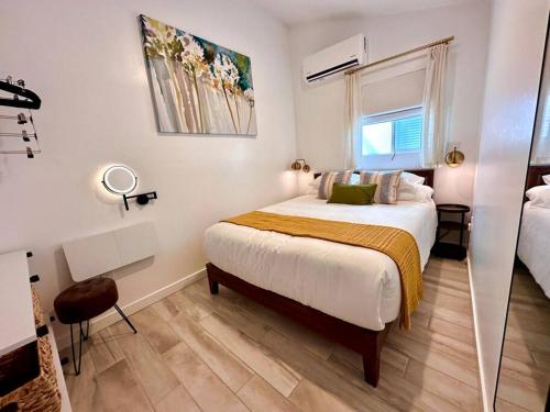 a bedroom with a large bed and a window at Casa Agave, 2 Bedroom, 1 Bath Guest House, with 3 Beds & Game Room in Vista