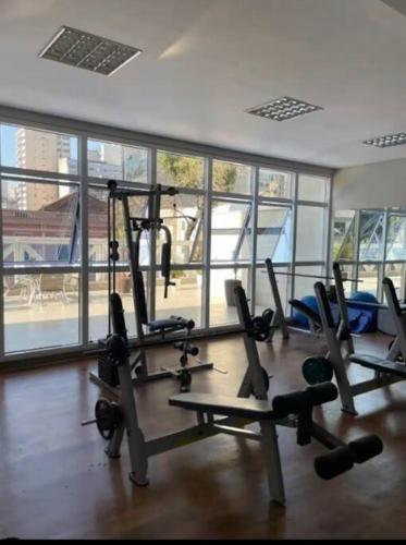 a gym with a bunch of exercise equipment in it at STUDIO - ao lado do batel in Curitiba