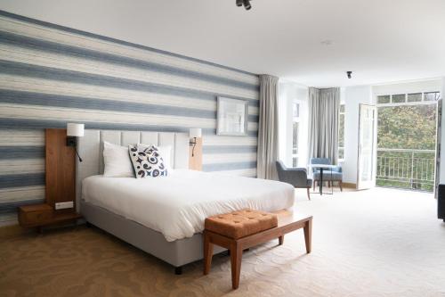 Postel nebo postele na pokoji v ubytování Grand Hotel Ter Duin