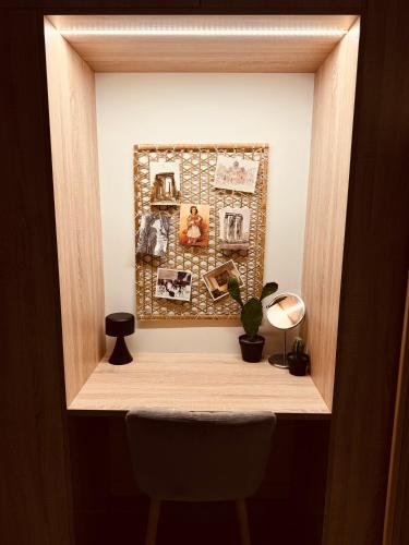 a shelf with a picture and a chair in a room at 2 BedRoom Apt - Live Like a Local in Kolonaki in Athens