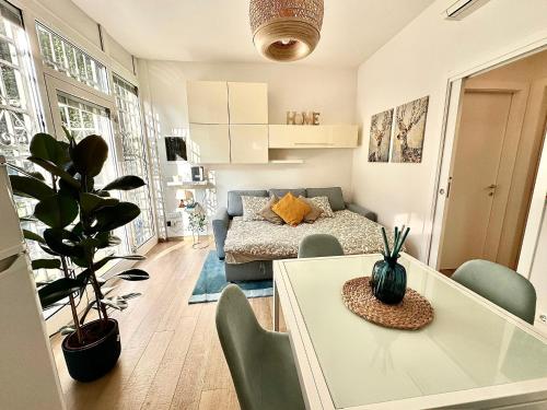 a living room with a bed and a table and chairs at Casa Sofia in Bologna