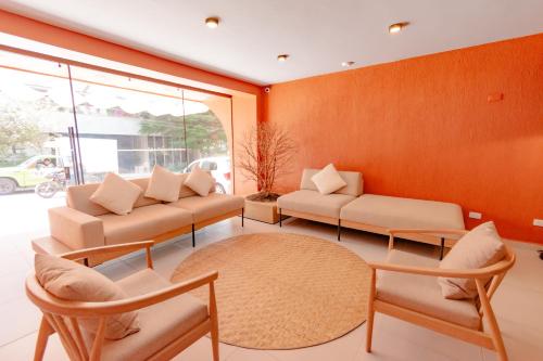 a living room with two chairs and a table at Leviu by Bernalo Hotels in Medellín