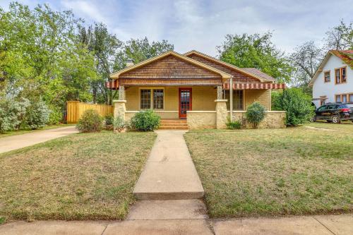a yellow house with a red door at Centrally Located Abilene Abode 2 Mi to Downtown! in Abilene