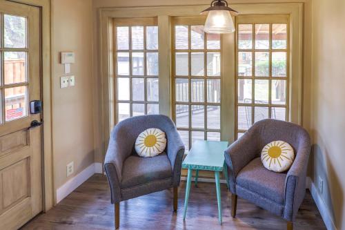 two chairs and a table in a room with windows at Centrally Located Abilene Abode 2 Mi to Downtown! in Abilene