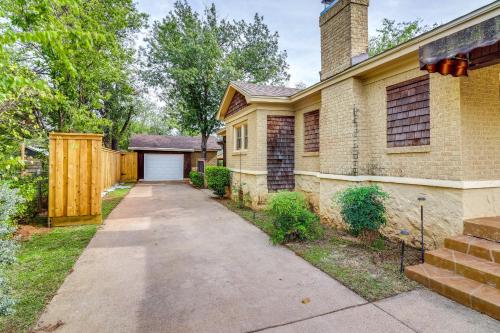 a house with a driveway leading to a garage at Centrally Located Abilene Abode 2 Mi to Downtown! in Abilene