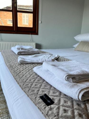 Postel nebo postele na pokoji v ubytování GaliniCafe22-suites