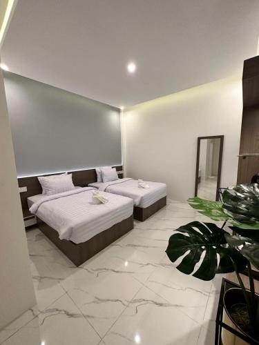 Postel nebo postele na pokoji v ubytování Resong Hotel