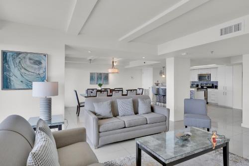 a living room with a couch and a table at Bahia Mar-Solare Tower, Beachfront Resort with Two Pools in South Padre Island