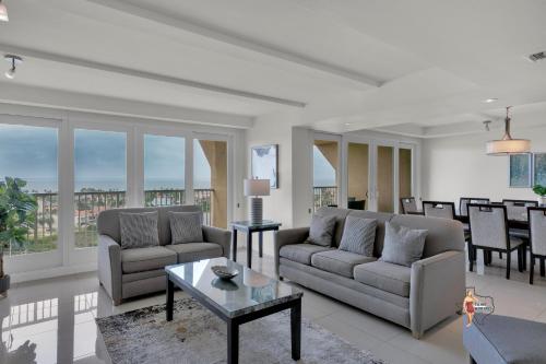 a living room with two couches and a table at Bahia Mar-Solare Tower, Beachfront Resort with Two Pools in South Padre Island