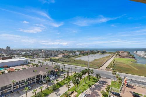 an aerial view of a street with palm trees and the ocean at Bahia Mar-Solare Tower, Beachfront Resort with Two Pools in South Padre Island