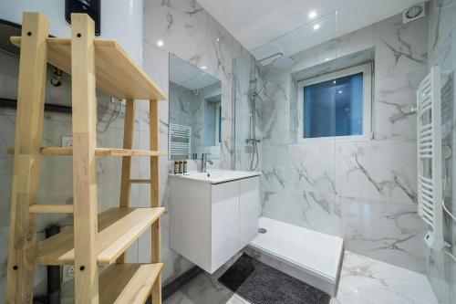 a bathroom with a toilet and a sink and a staircase at The Comte House - 16 Guests Near Disney in Villeneuve-le-Comte