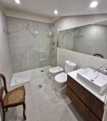 a bathroom with a sink and a toilet and a shower at Casa Francisca praia de Mindelo in Mindelo