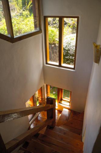 an overhead view of a staircase with two windows at Lelikelen Cabañas del Bosque in Villa La Angostura