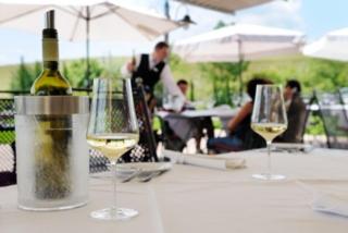 two glasses of white wine sitting on a table at Heitlinger Hof in Tiefenbach