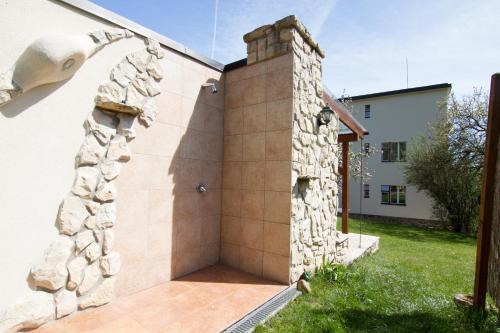 a shower built into the side of a house at Pension Karnet in Prague
