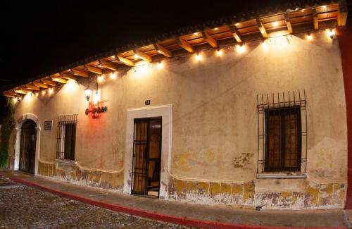 a building with lights on the side of it at Hot Chipilin in Antigua Guatemala
