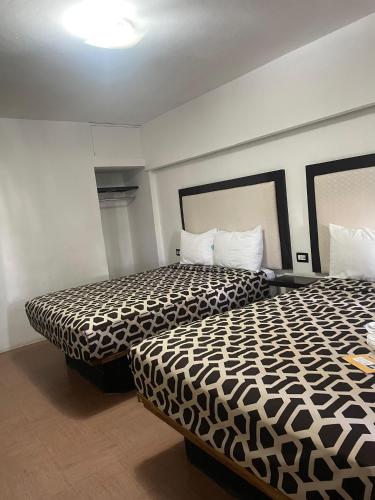 Кровать или кровати в номере Hotel Essen's