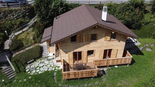 a model of a wooden house with a roof at Chalet Villars-Gryon 8pax Cosy in Gryon
