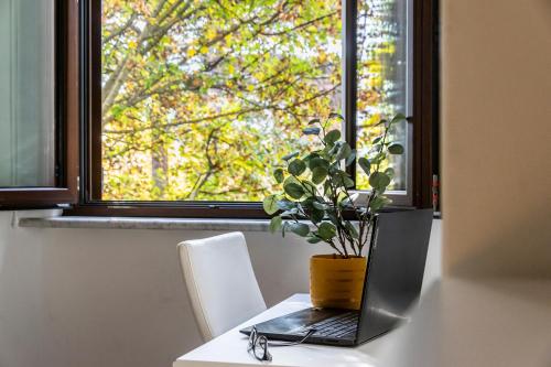 a laptop sitting on a table in front of a window at Al CASTELLO AVEZZANO in Avezzano