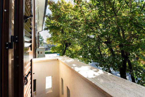 an open door to a balcony with a tree at Al CASTELLO AVEZZANO in Avezzano