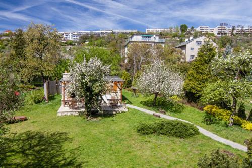 an aerial view of a garden with trees and buildings at Pension Karnet in Prague
