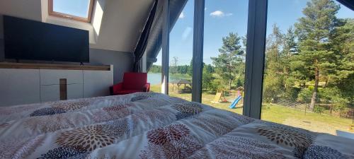 Postel nebo postele na pokoji v ubytování Ostoja Klocek