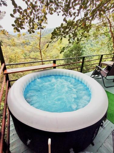 a jacuzzi tub sitting on a deck at Allegro Eco Glamping in San Francisco