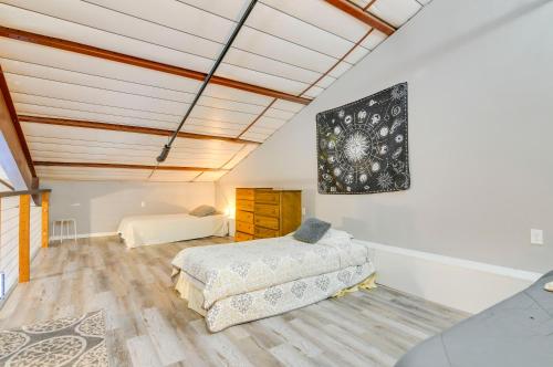 a bedroom with two beds in a room with a ceiling at Del Norte Apartment with Loft Walk to Downtown! in Del Norte