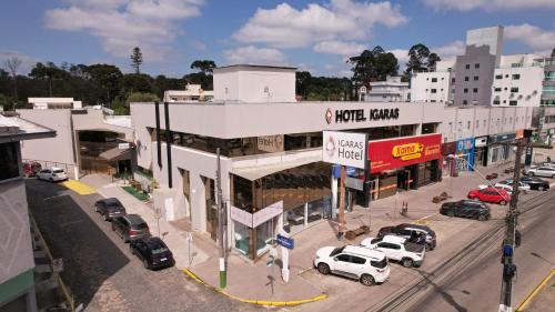 an overhead view of a city with cars parked on a street at Igaras Hotel in Otacílio Costa