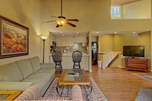 a living room with a couch and a table at Foxhunt at Sapphire Valley in Sapphire