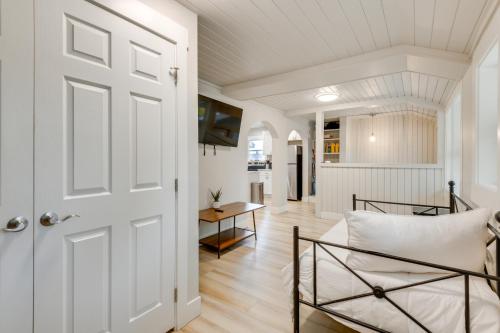 a door leading into a living room with a table at 6 Mi to Shoshone Falls Park Home with Game Room! in Twin Falls