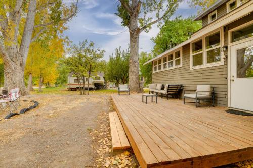 a wooden deck on the side of a house at 6 Mi to Shoshone Falls Park Home with Game Room! in Twin Falls