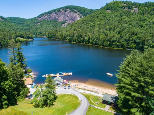 an aerial view of a lake with a beach at Foxhunt at Sapphire Valley in Sapphire