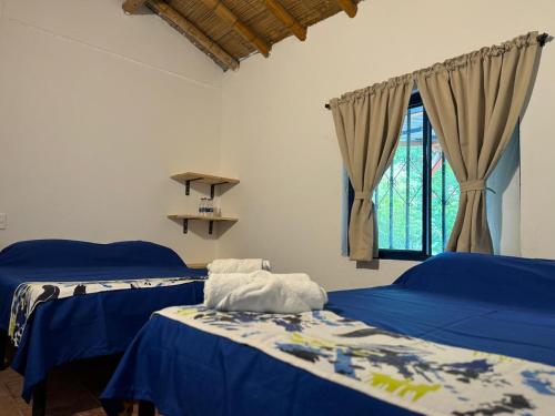 Finca Hotel San Cristobal Quindioにあるベッド