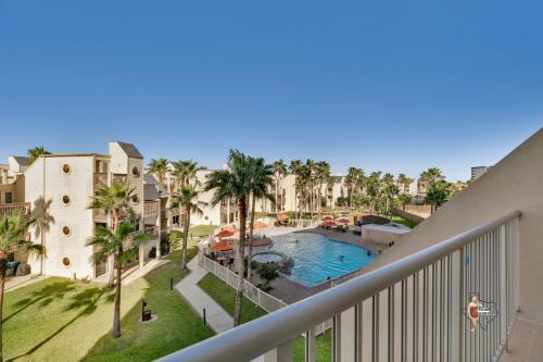 a view of the pool from the balcony of a resort at Bahia Mar-Solare Tower, Beachfront Resort with Two Pools in South Padre Island