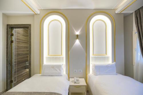 Ein Bett oder Betten in einem Zimmer der Unterkunft Pyramids Plateau Hotel
