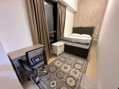 a small room with a bed and a television at Fabulous Palm View in Dubai