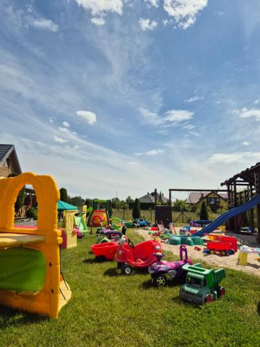 a group of playyards with toy cars and slides at USTECKA OSADA II Ustka Przewłoka in Ustka