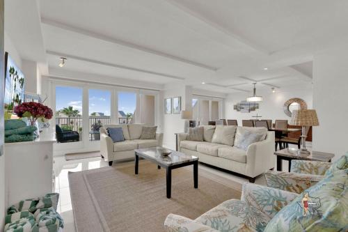 a living room with two couches and a dining room at Bahia Mar-Solare Tower, Beachfront Resort with Two Pools in South Padre Island