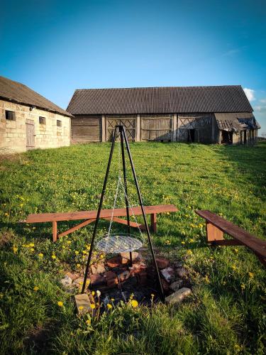 a picnic table in the middle of a field at Domek z ogrzewaniem podłogowym in Wyszki