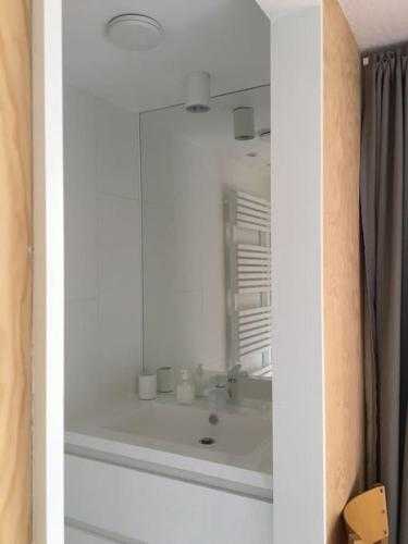 a bathroom with a sink and a mirror at Super view Am Flachsberg in Butgenbach