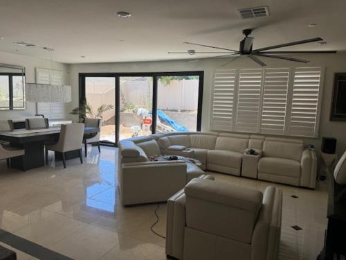 a living room with a couch and a dining room at Elegant Retreat with Private Luxurious Gen Suite in Menifee