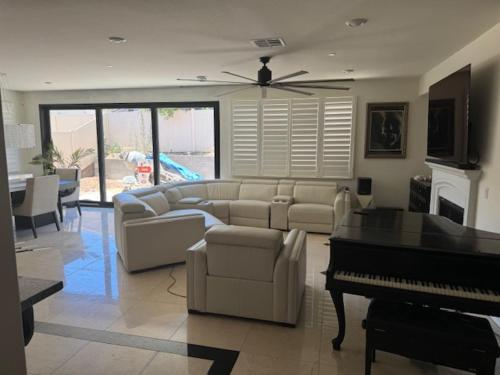 a living room with a couch and a piano at Elegant Retreat with Private Luxurious Gen Suite in Menifee
