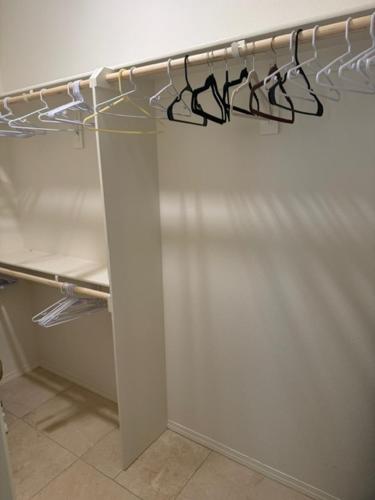 a white refrigerator with its door open with its door at Elegant Retreat with Private Luxurious Gen Suite in Menifee