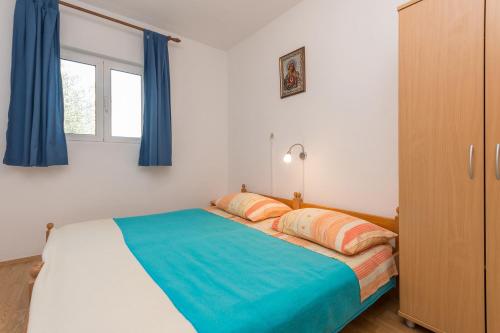 Ένα ή περισσότερα κρεβάτια σε δωμάτιο στο House Tiana