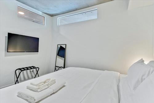 Ένα ή περισσότερα κρεβάτια σε δωμάτιο στο Luxury Building - DT SLC - Heated Pool - Parking